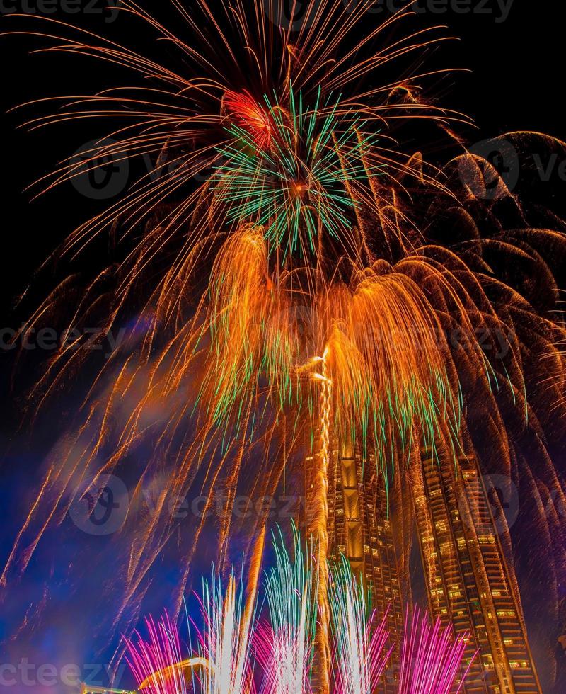 Colourful New Years Fireworks Display lighting up the night sky at Chao Phraya river.  as New Year Day, photo