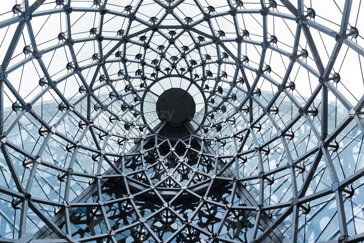 High-Rise Building structure as a whirl architecture rooftop made from metal material to wire web tube in the abstract ornament background. photo