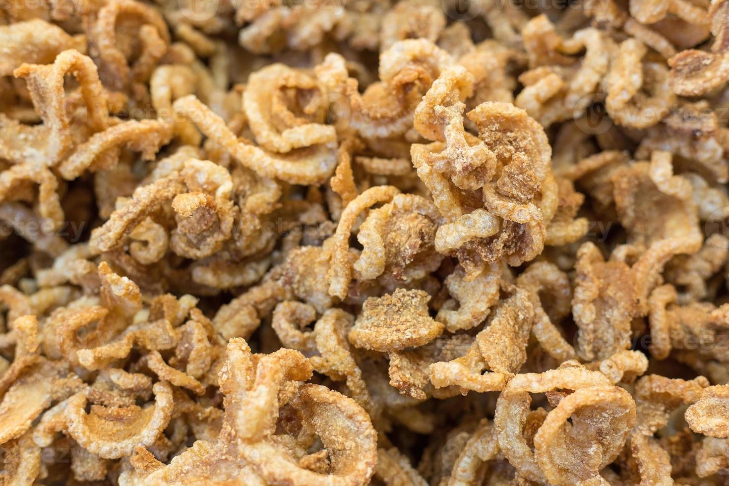 Pork crackling pork snack, pork scratching is fried pork skin as snack and we can eat it with noodles in Thai food style. photo