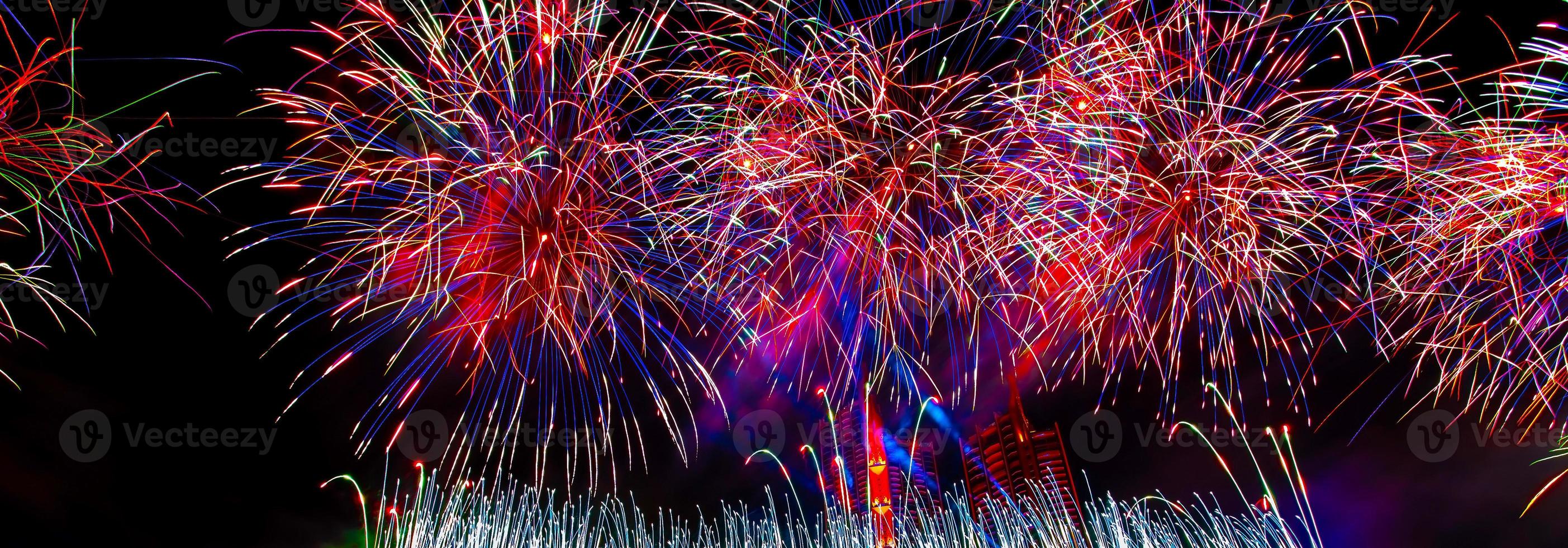 Colorful fireworks in celebrate new year at Chao Phraya river in Bangkok, Thailand. photo