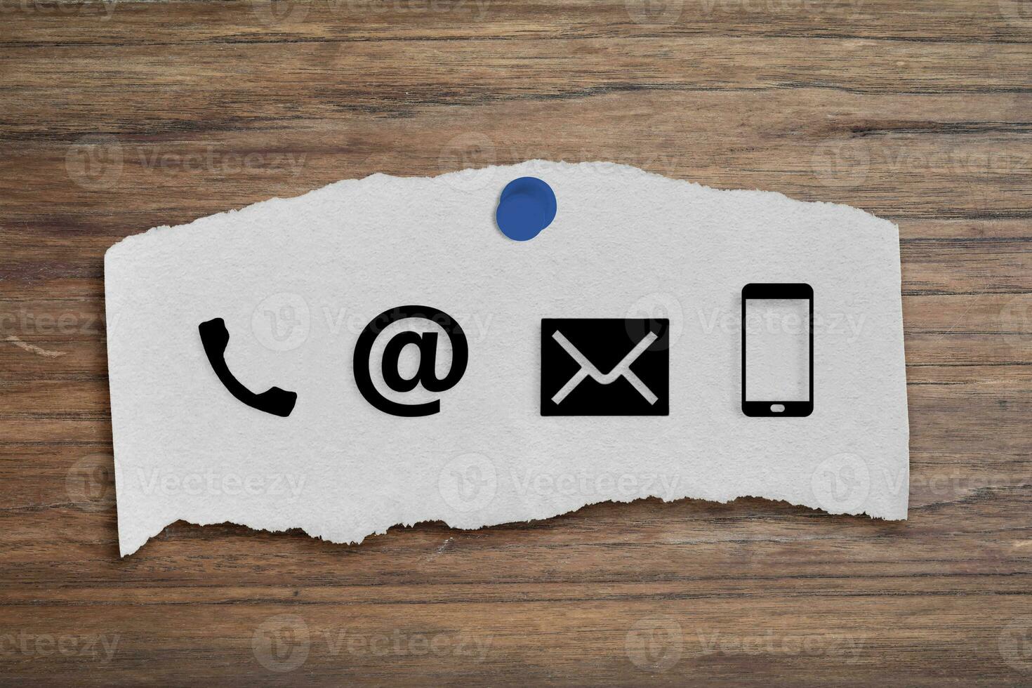 CONTACT US Icons on post it on wood table. Concept of business or customer service. photo