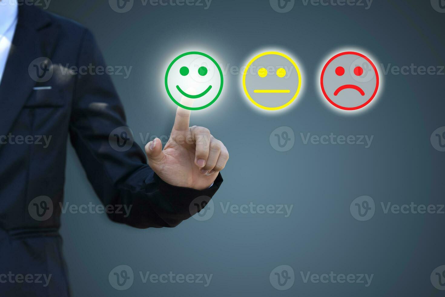 Businessman pressing smiley face icon on virtual screen. Concept of satisfaction evaluation and feedback. photo