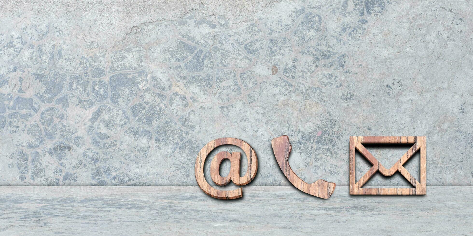 Phone, Email and Post Icons Leaning on cement wall. copy space. Contact us. photo