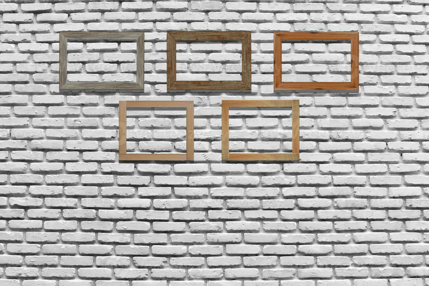 Vintage photo frames on brick wall for interior or background.