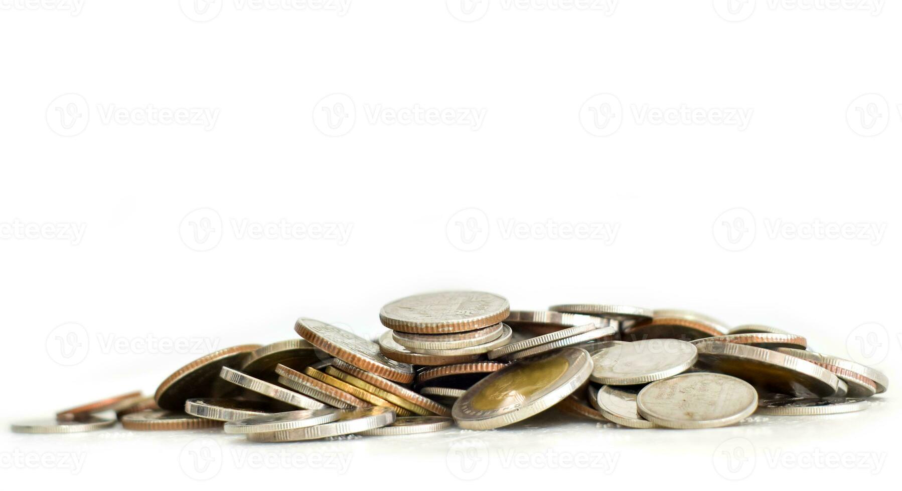 Pile of coins on white background. selective focus. Saving coins money concept photo