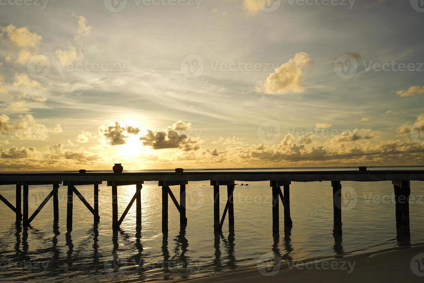 wooden bridge on the beach photo