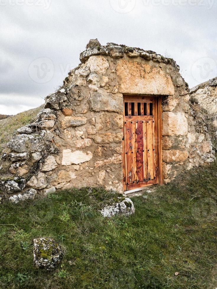 Entrances to subway cellars built in stone, in the village of Soria. hobbit houses photo