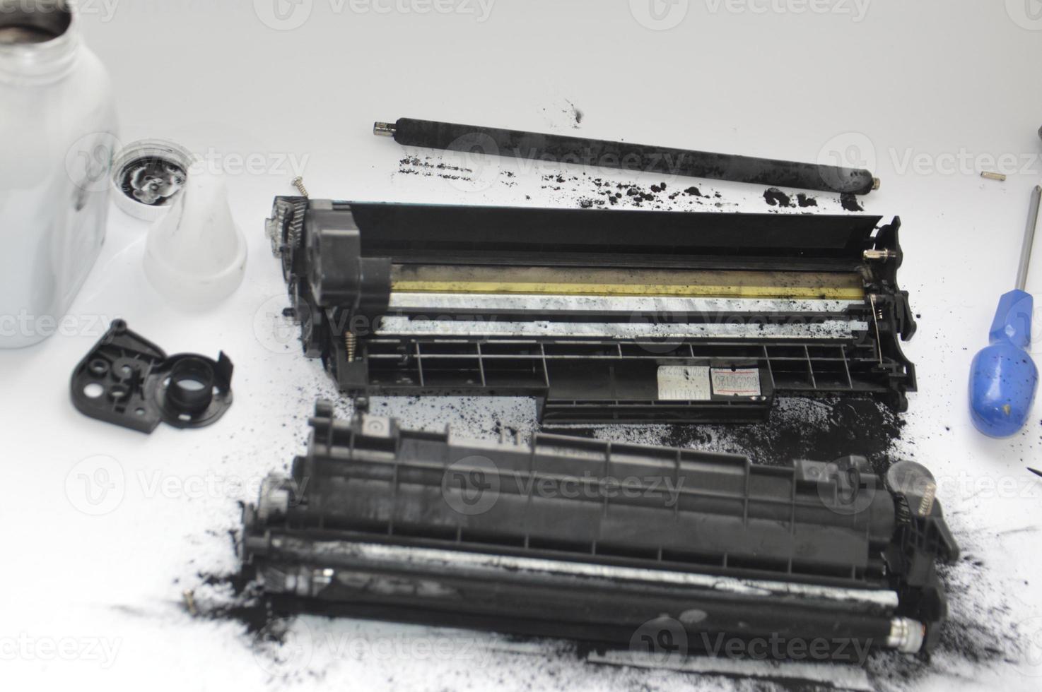 Charging the laser printer cartridge with toner powder photo