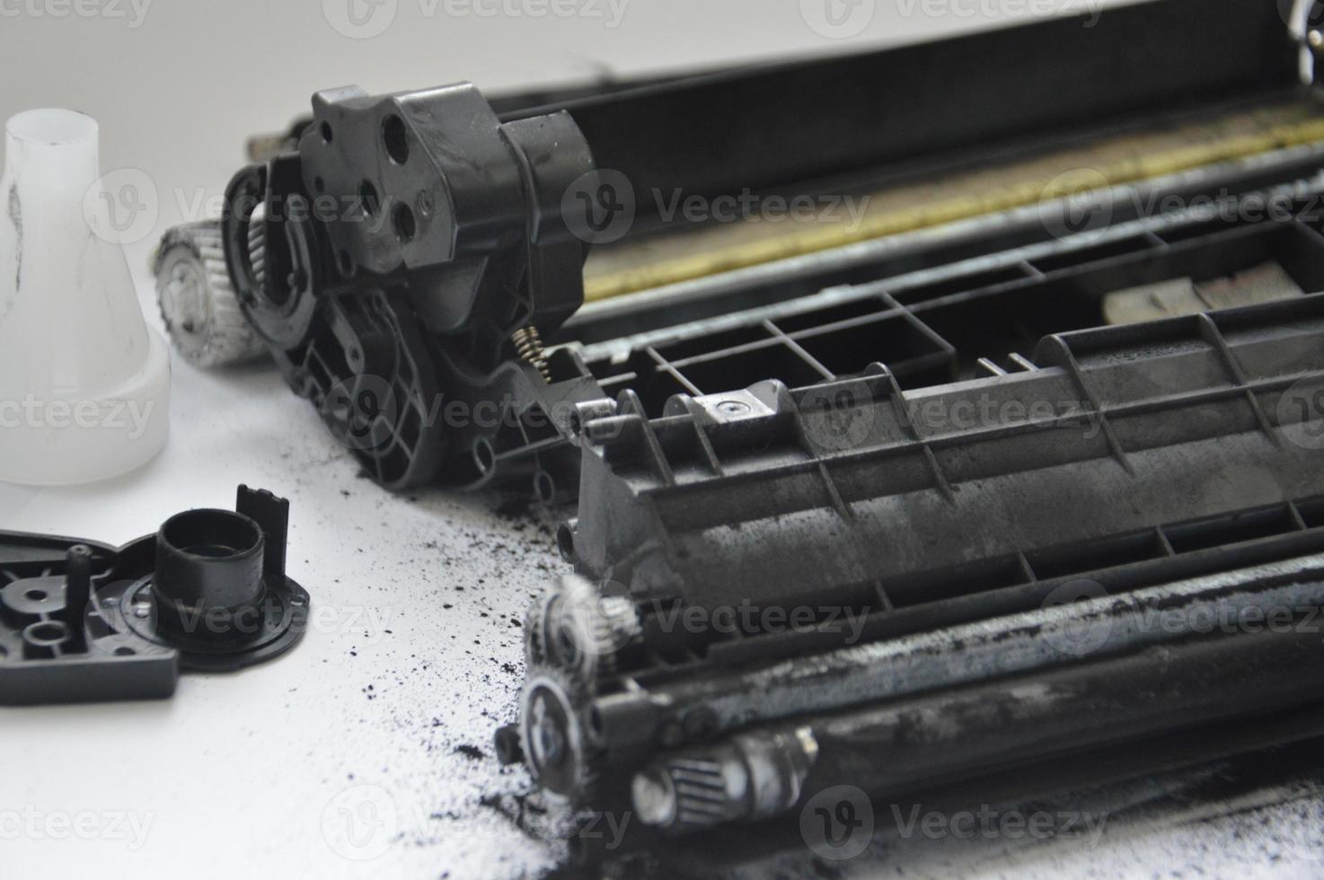 Charging the laser printer cartridge with toner powder photo