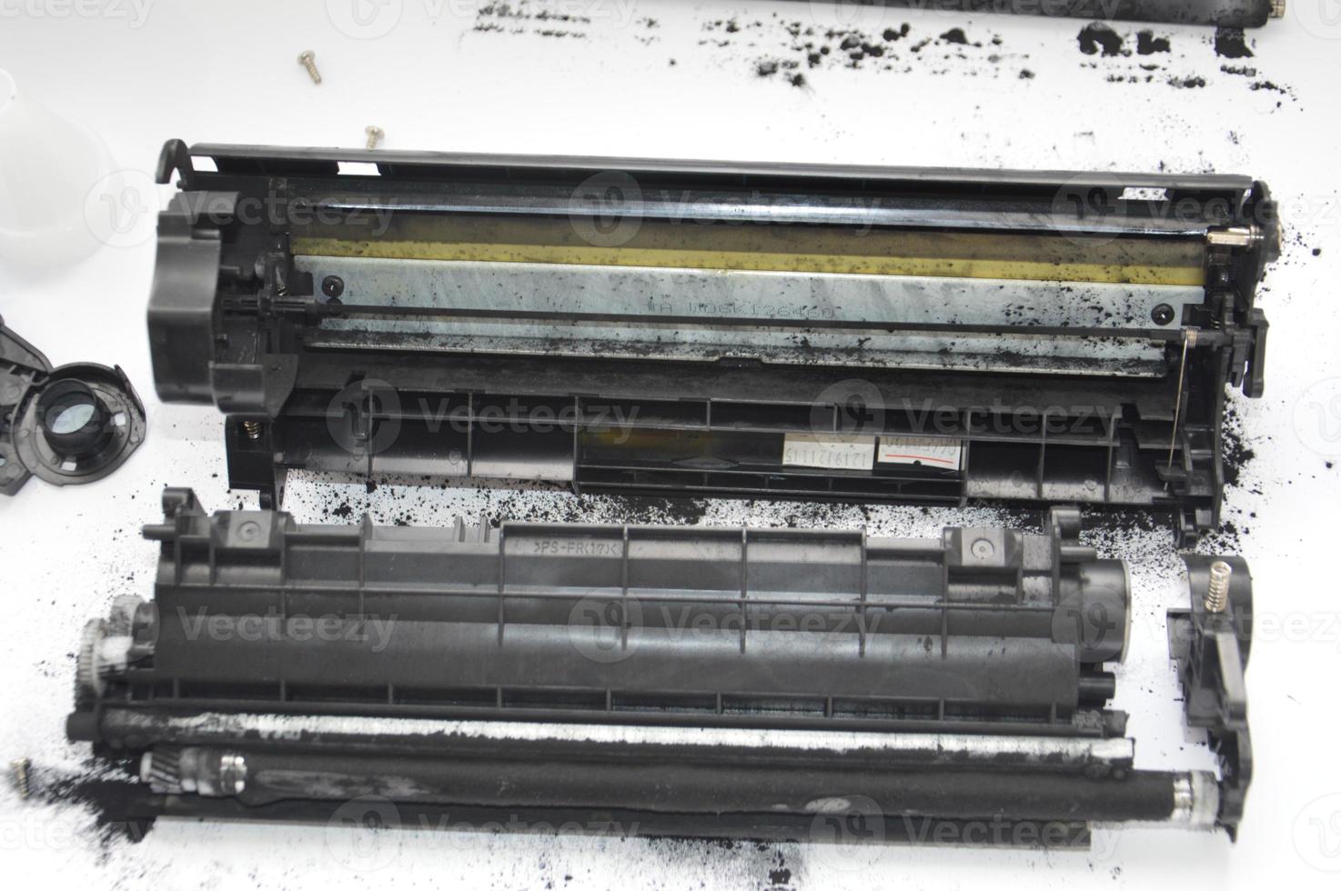 Charging the laser printer cartridge with toner powder photo