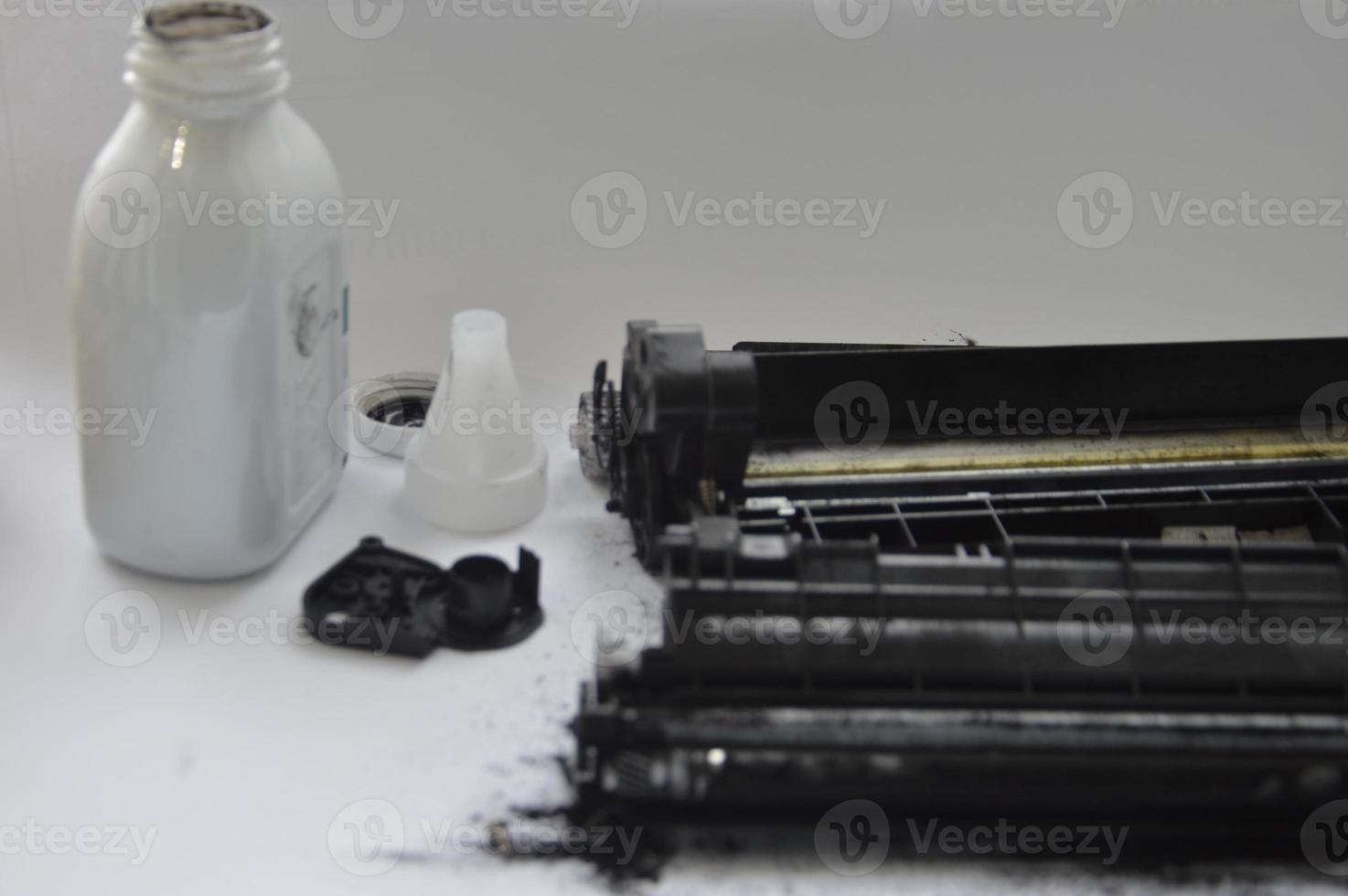 Charging the laser printer cartridge with toner powder photo