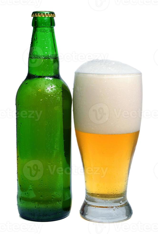 beer is in a bottle and glass photo
