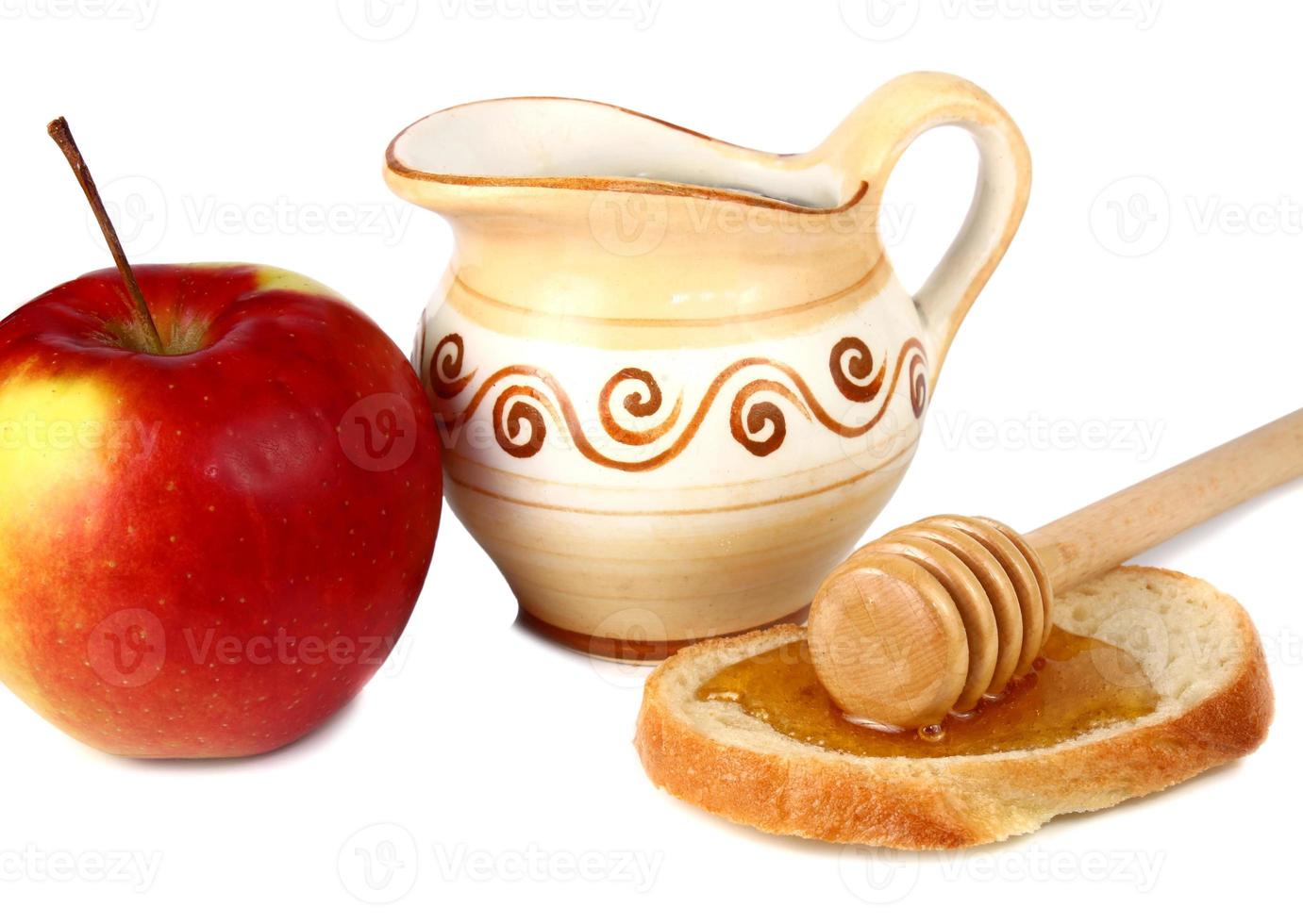 honey in a jug and apple photo