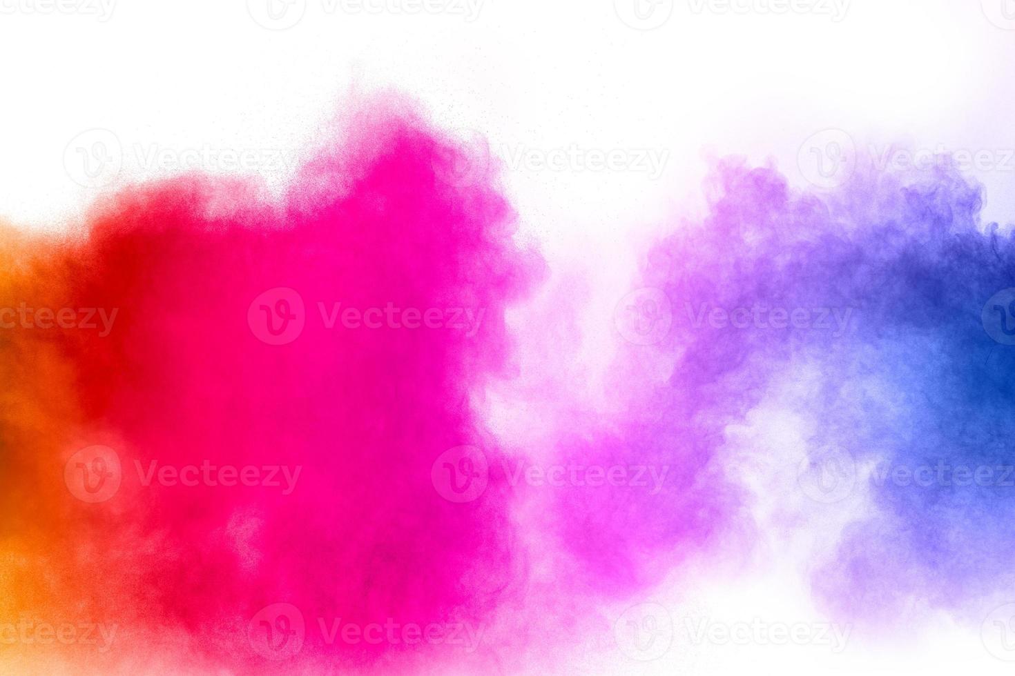 Freeze motion of colorful dust particles on white background.Abstract pastel color powder overlay texture. photo