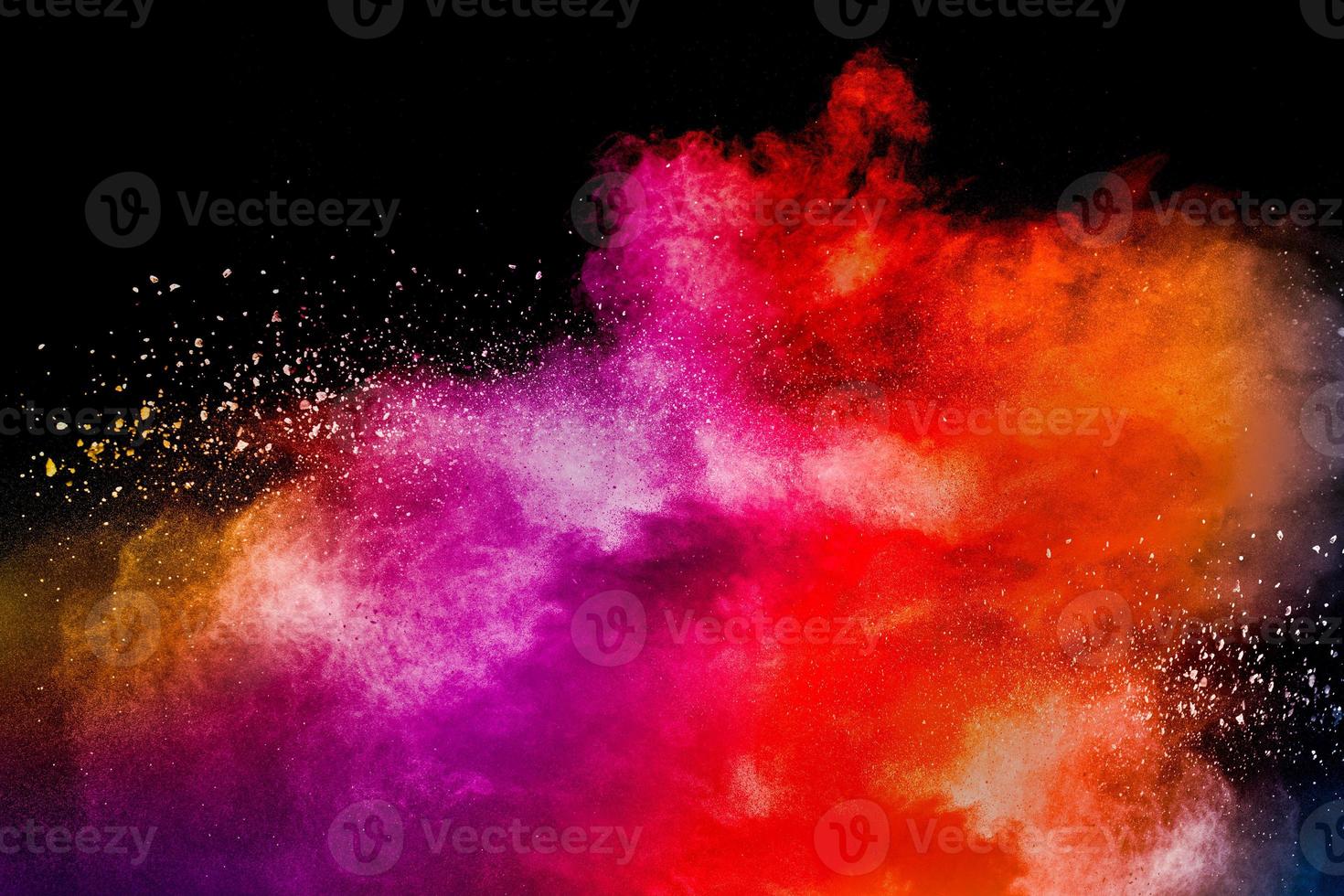 Colored powder explosion. Abstract closeup dust on backdrop. Colorful explode. Paint holi. photo