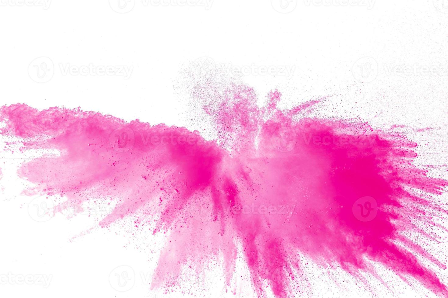 Pink dust particles splash.Pink powder explosion on white background. photo