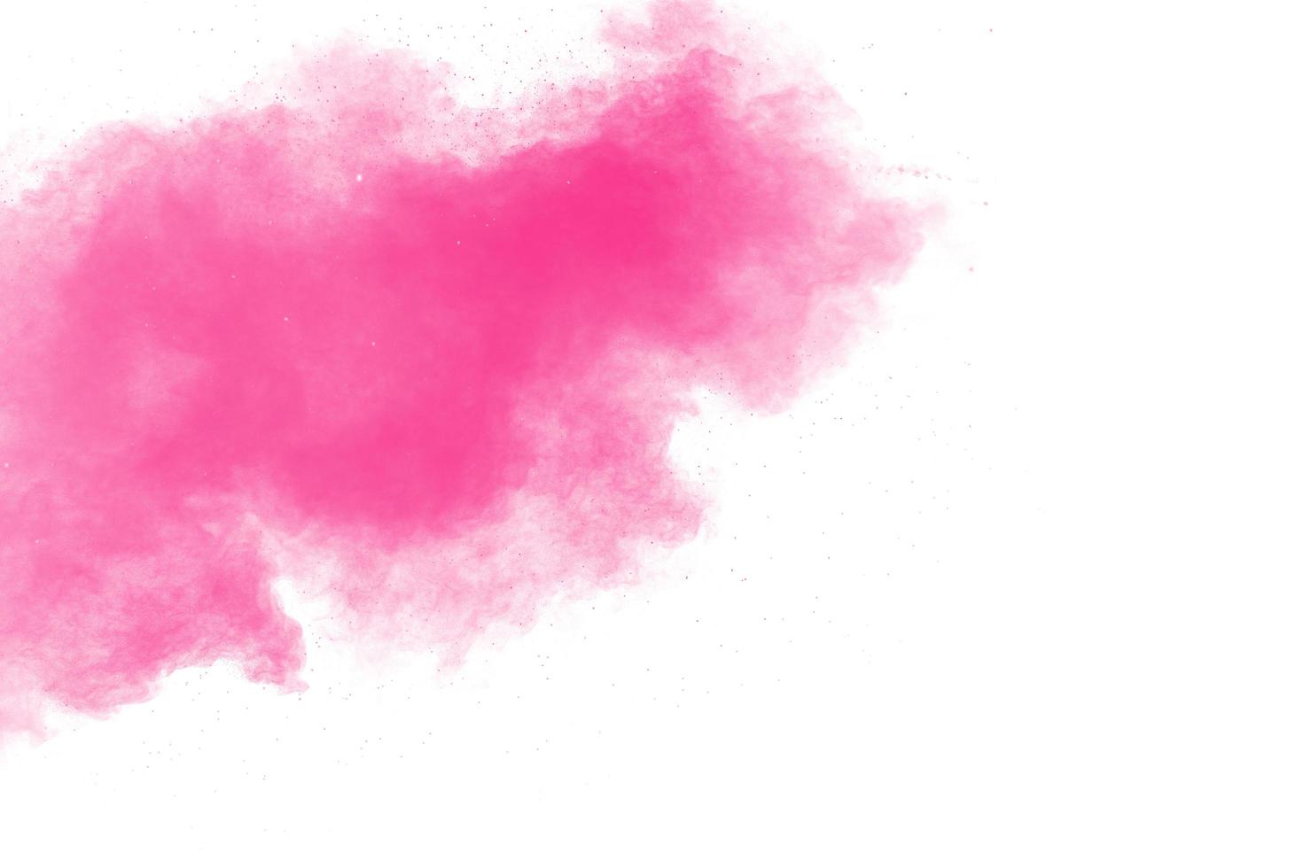Pink powder explosion on white background.Pink dust splashing. photo