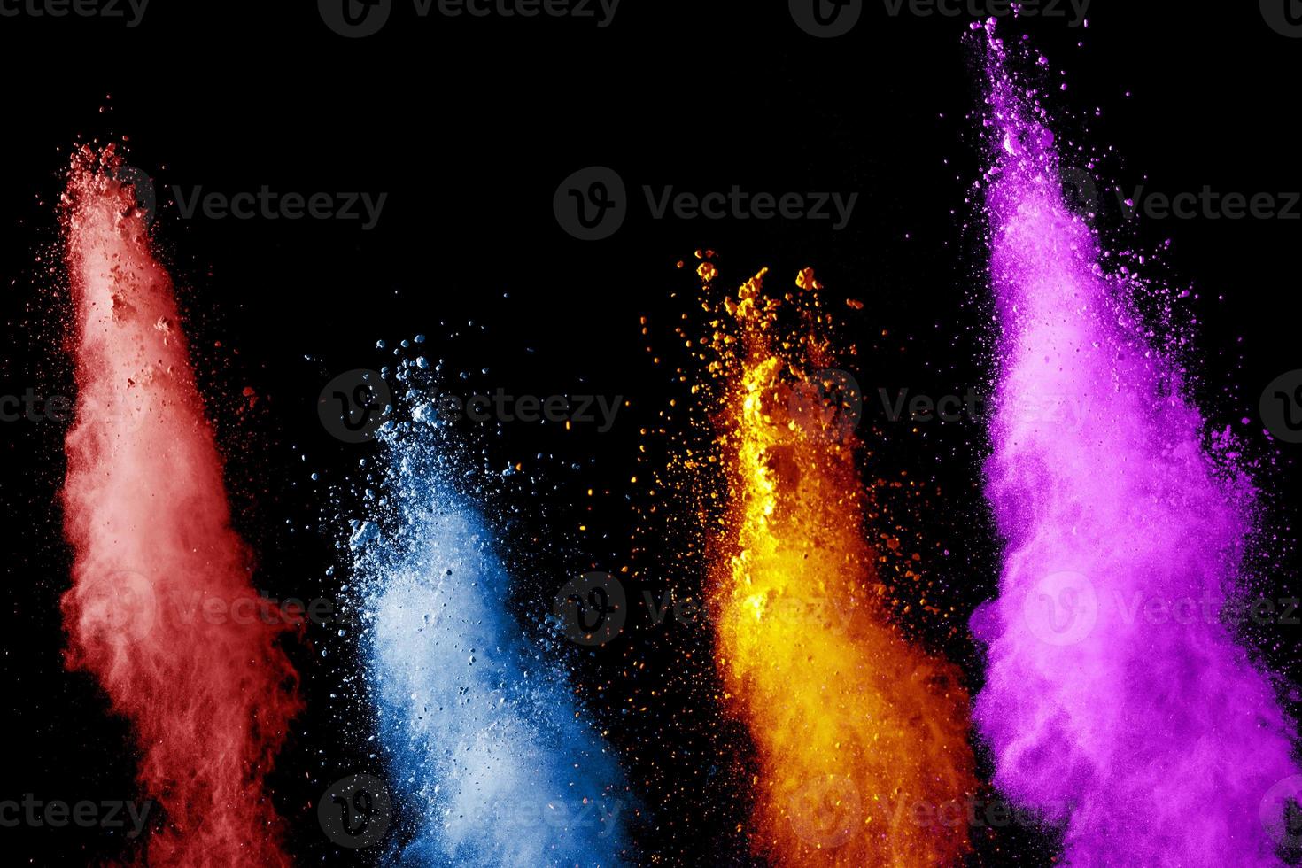 abstract color powder explosion on black background.abstract  Freeze motion of color dust  particles splash. photo