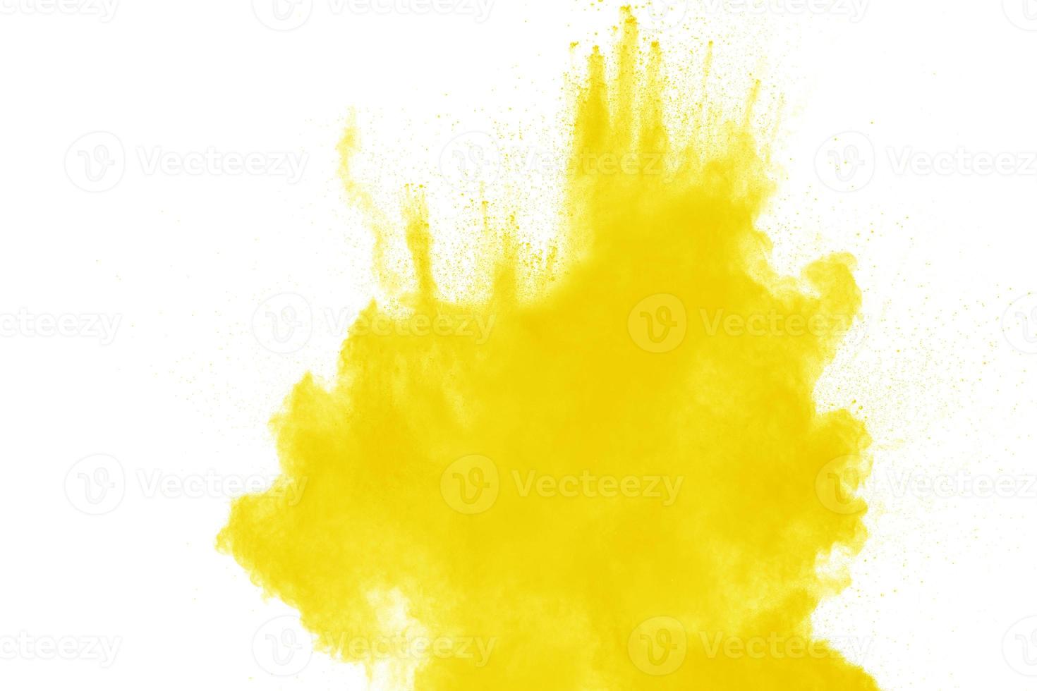 Yellow dust particles explosion on white background. Yellow powder dust