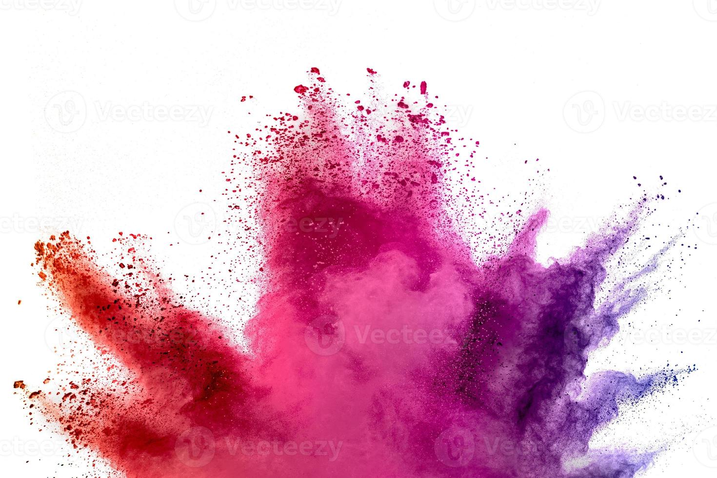 Abstract multicolored powder splash on white background.Freeze motion of color powder exploding. photo