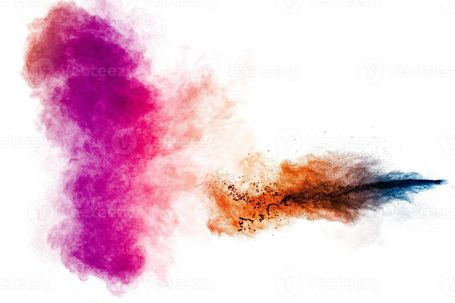 Multicolored particle exploding on white background. Colorful dust splashing. photo