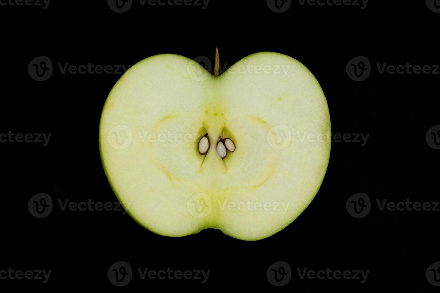 Fresh green apple and sliced isolated on black background. photo