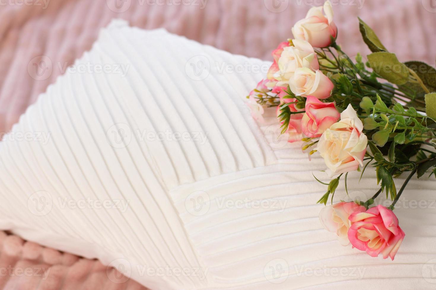 Pink roses on pillow, flowers on bed, lifestyle romantic staging photo