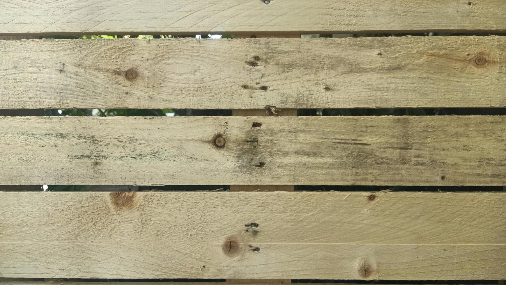 Wood texture of pallet is rough and not tightly arranged, free photo background closeup of the wooden planks