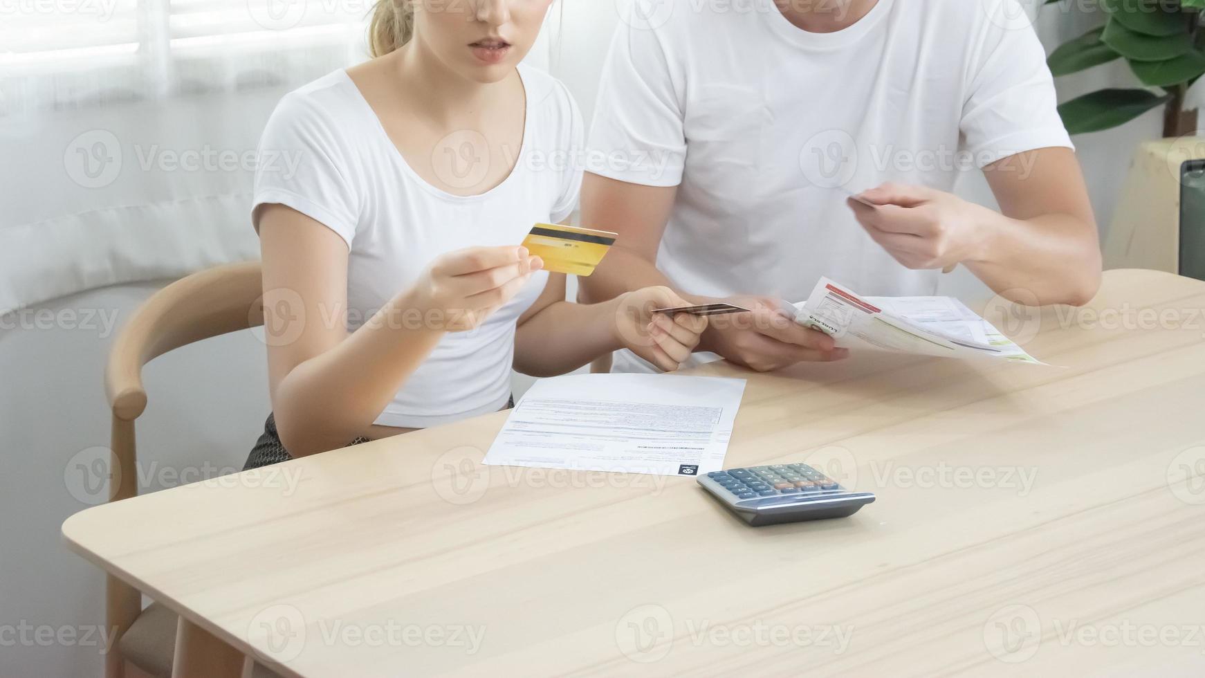 Men and women are in debt with credit cards invoices. photo