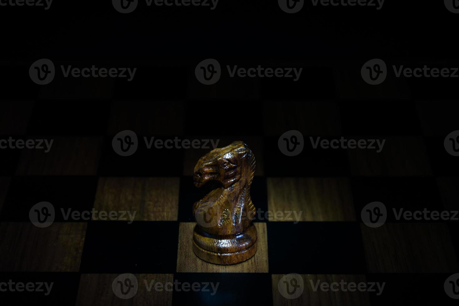 chess figure on chess board game concept for ideas black background photo