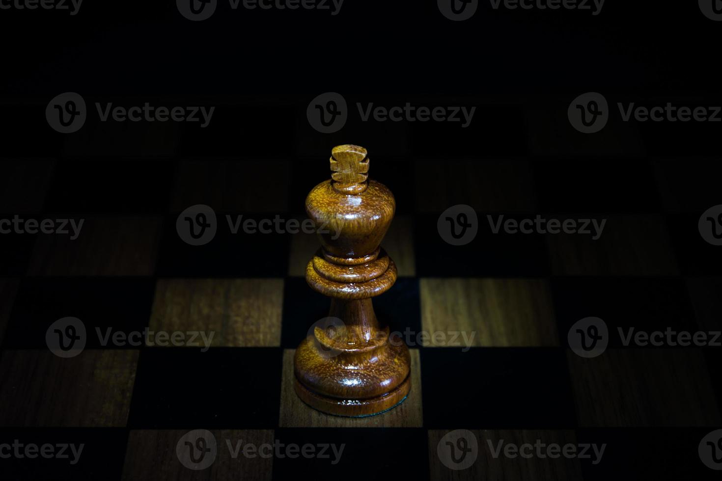 chess figure on chess board game concept for ideas black background photo