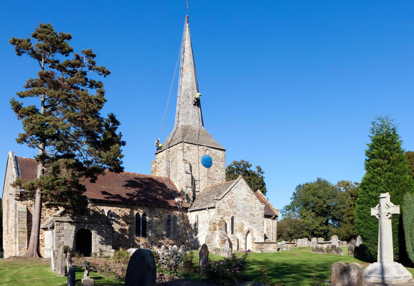 HORSTED KEYNES, SUSSEX, UK, 2009. Steeplejacks working on the church roof photo