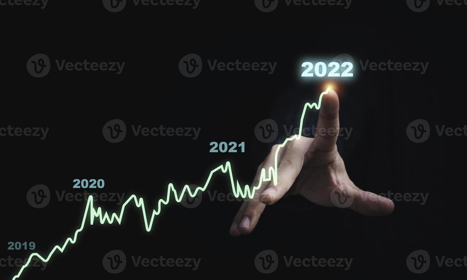 Businessman drawing virtual technical graph and chart for analysis stock market, technology investment and value investment concept. photo