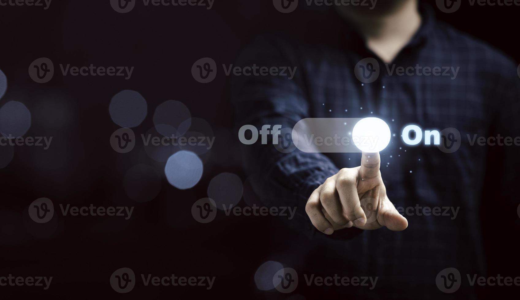 Businessman touching to virtual toggle switch button for change from off to on. photo