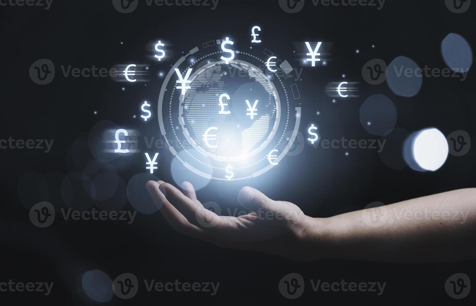 Hand holding virtual world with currency sign for forex exchange and global money transfer by technology concept. photo