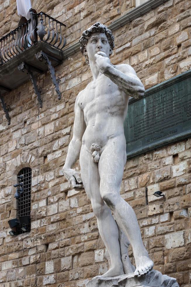 FLORENCE, TUSCANY, ITALY, 2019.Statue of David by Michelangelo on the Piazza della Signoria in front of the Palazzo Vecchio photo