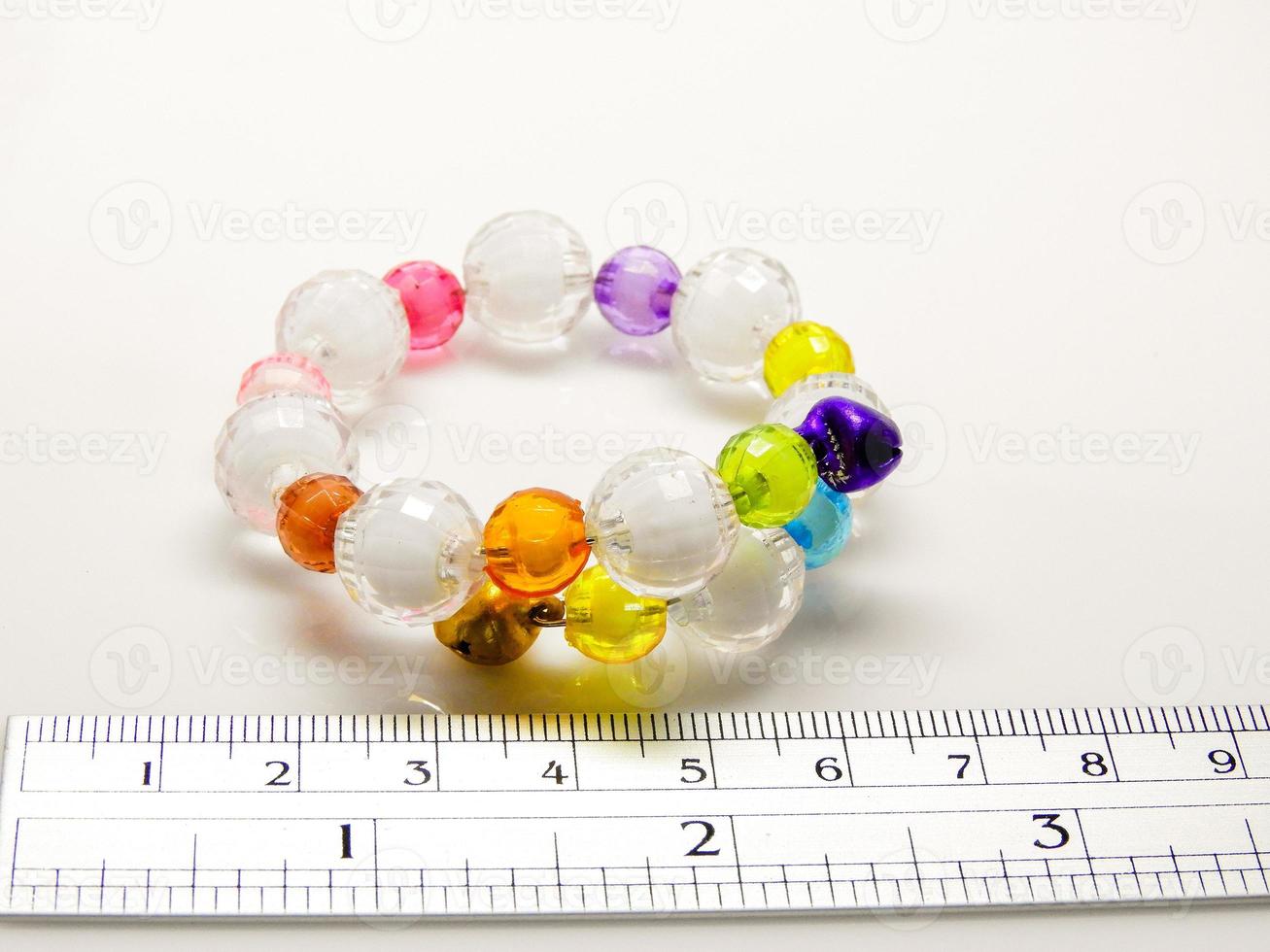 Multi-colored bracelets with beads. Colourful child's bead bracelet. photo