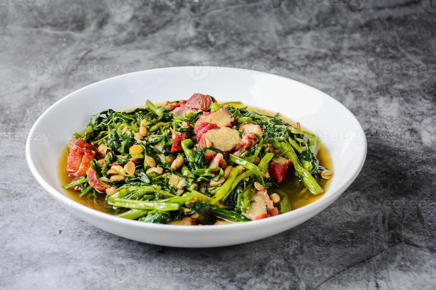 Fried water spinach with barbecued red pork photo