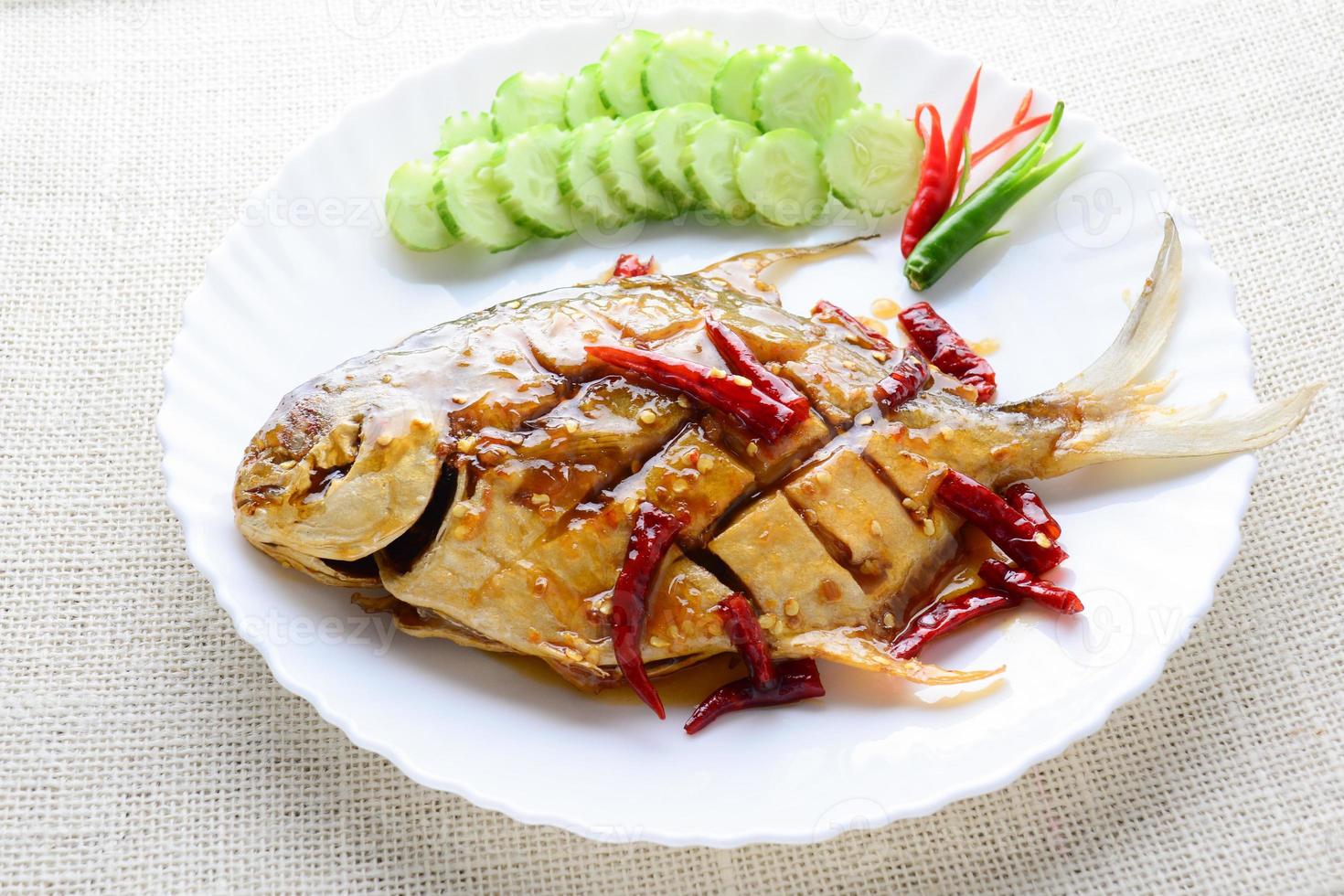 Deep Fried White Pomfret With Black Pepper Garlic, quick and easy dish. photo