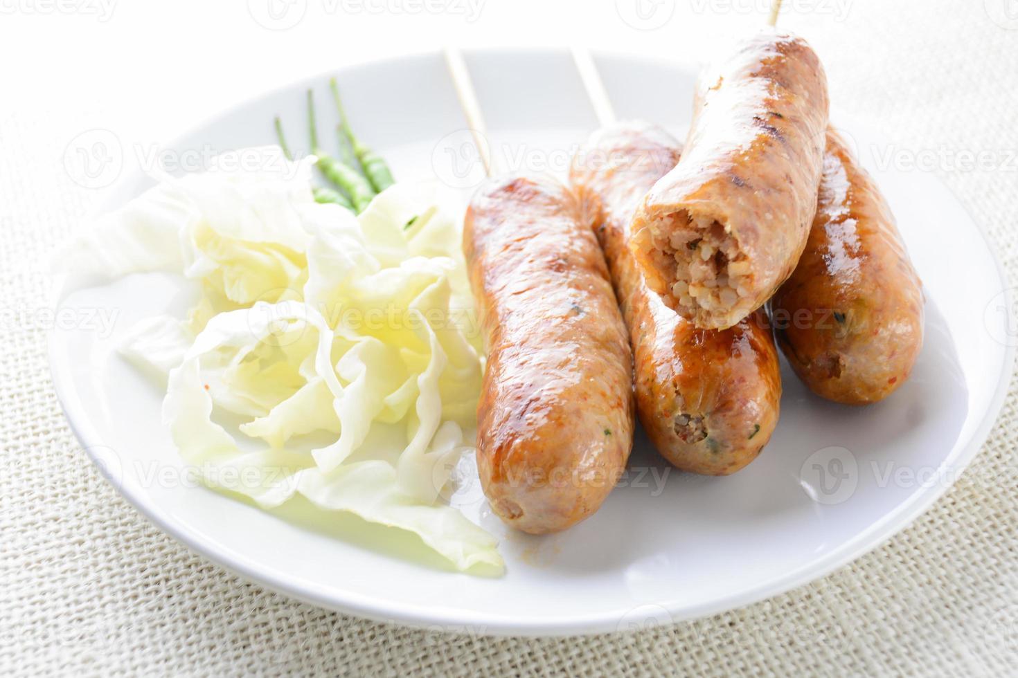 Thai Spicy Sausages, made from minced pork mixed with a variety of ingredients which makes it packed with flavour, and gives it a unique scent. photo