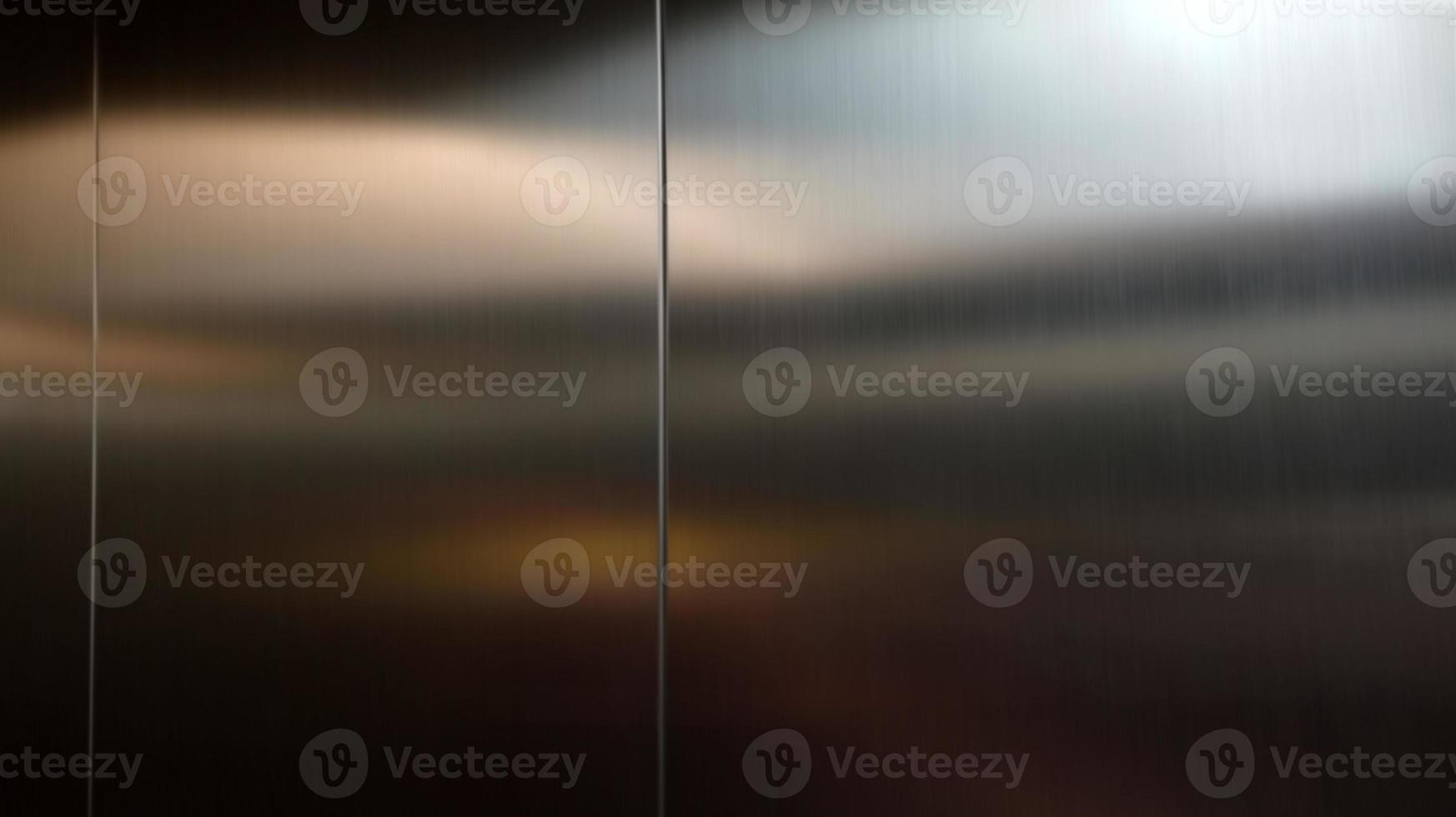 Stainless steel large sheet  With light hitting the surface  For background,Inside passenger elevator,Reflection of light on a shiny metal texture,stainless steel background. photo