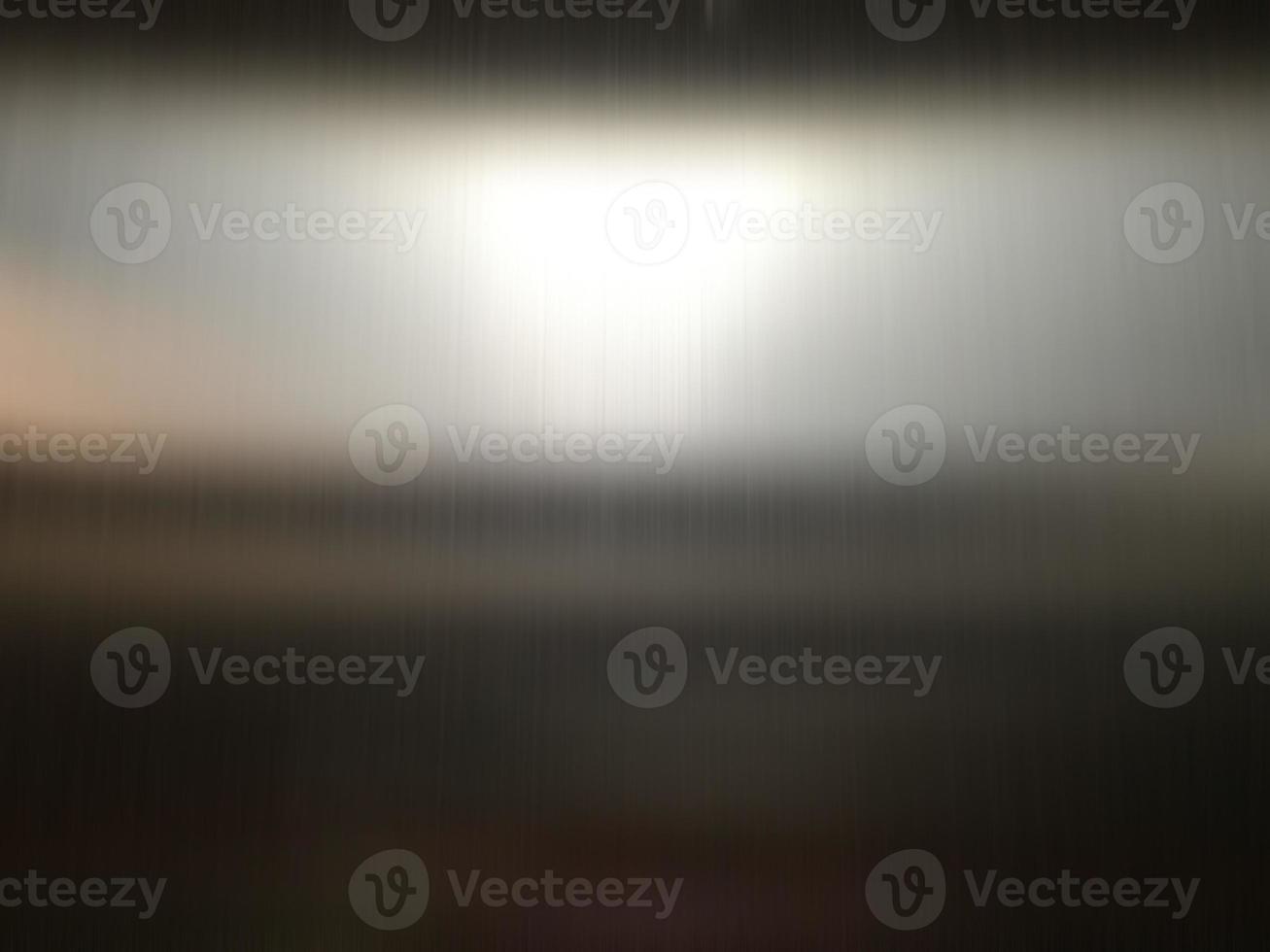 Stainless steel large sheet  With light hitting the surface  For background,Inside passenger elevator,Reflection of light on a shiny metal texture,stainless steel background. photo