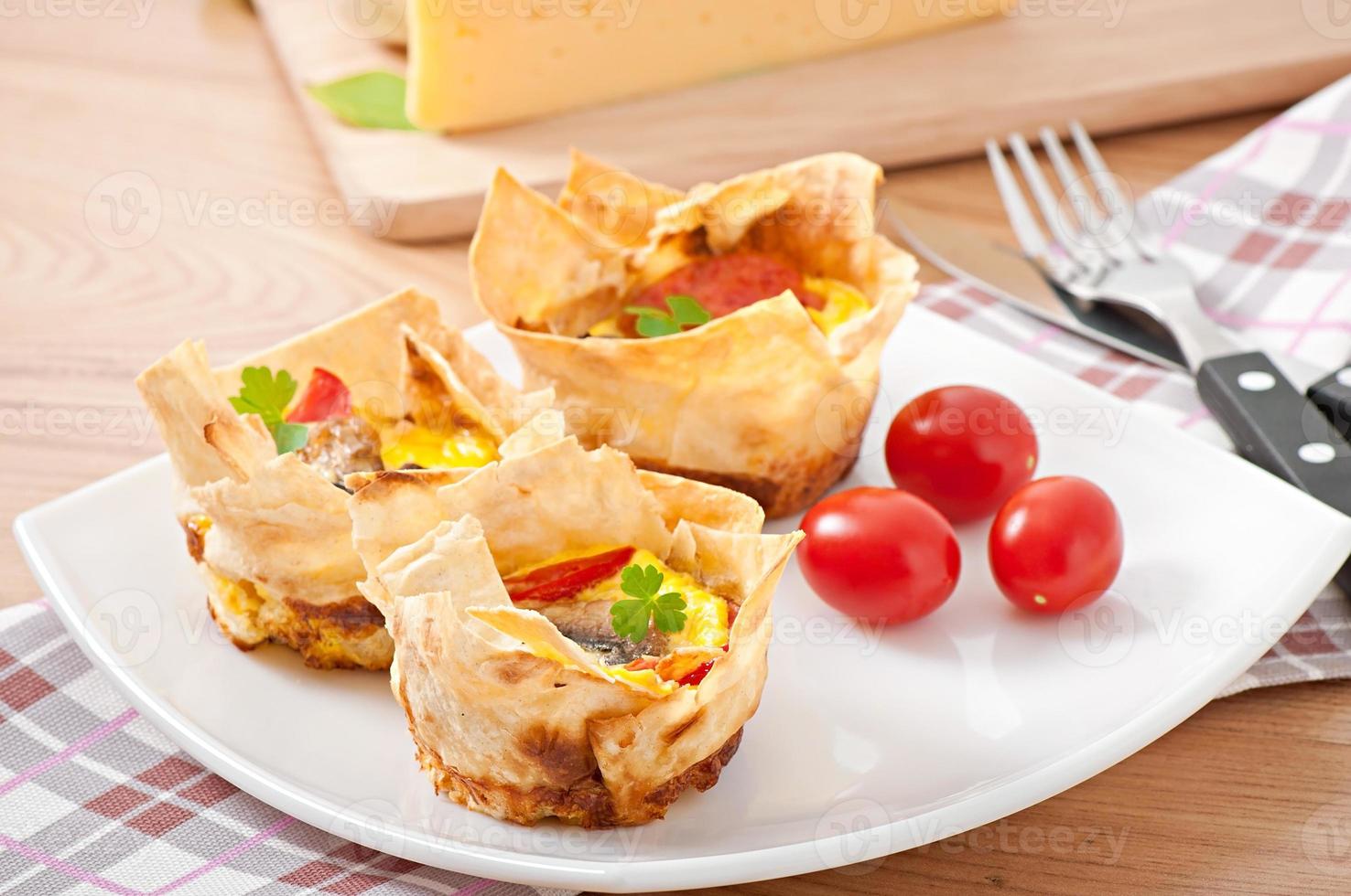 omelet in pita bread with tomato, bacon and mushrooms photo