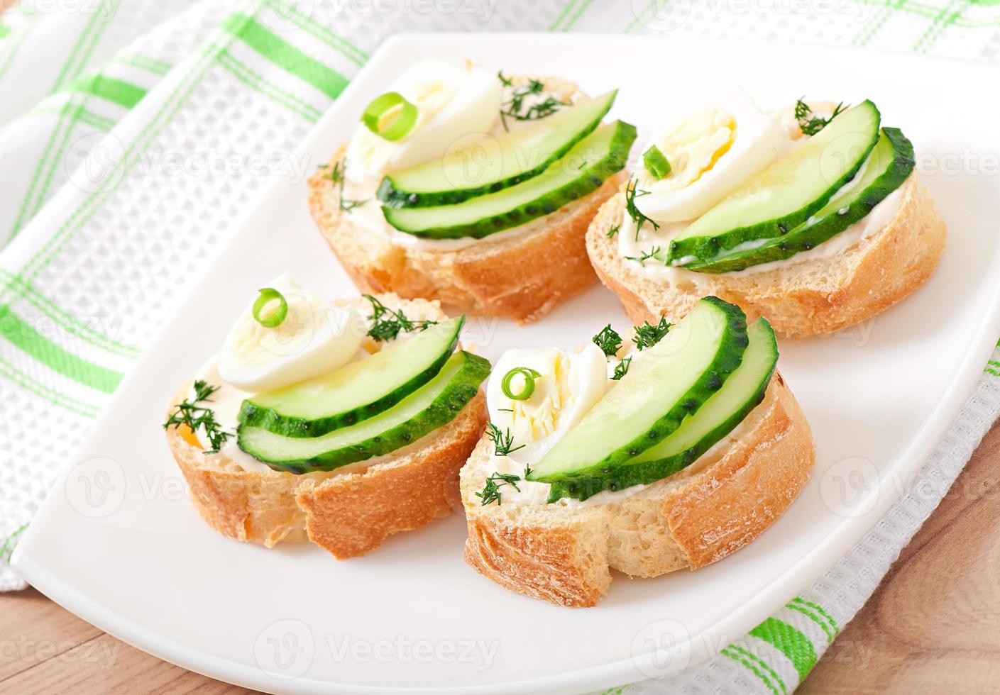 sandwiches with boiled egg and cucumber photo