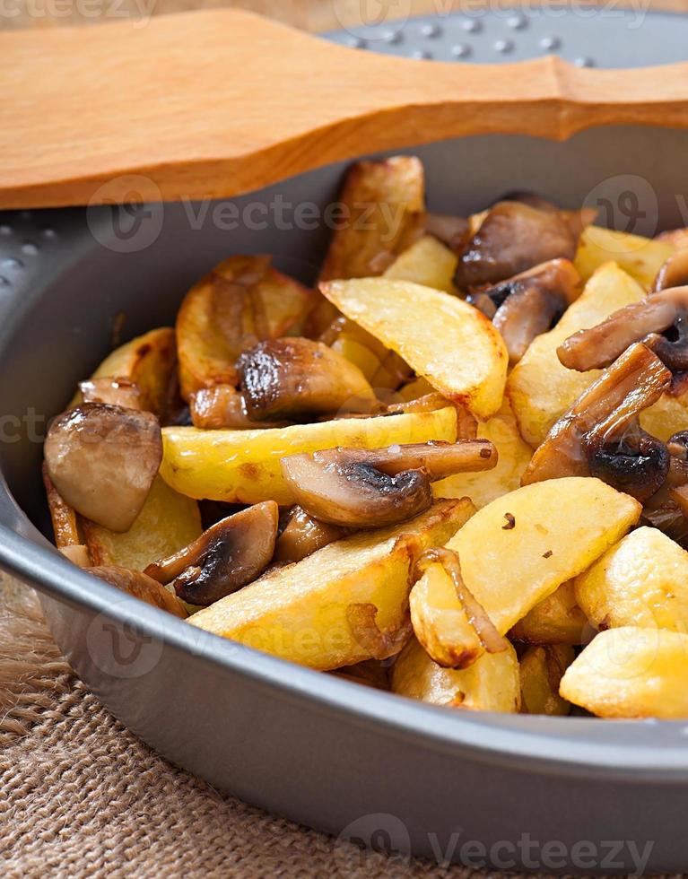 Fried potatoes with mushrooms and onions photo