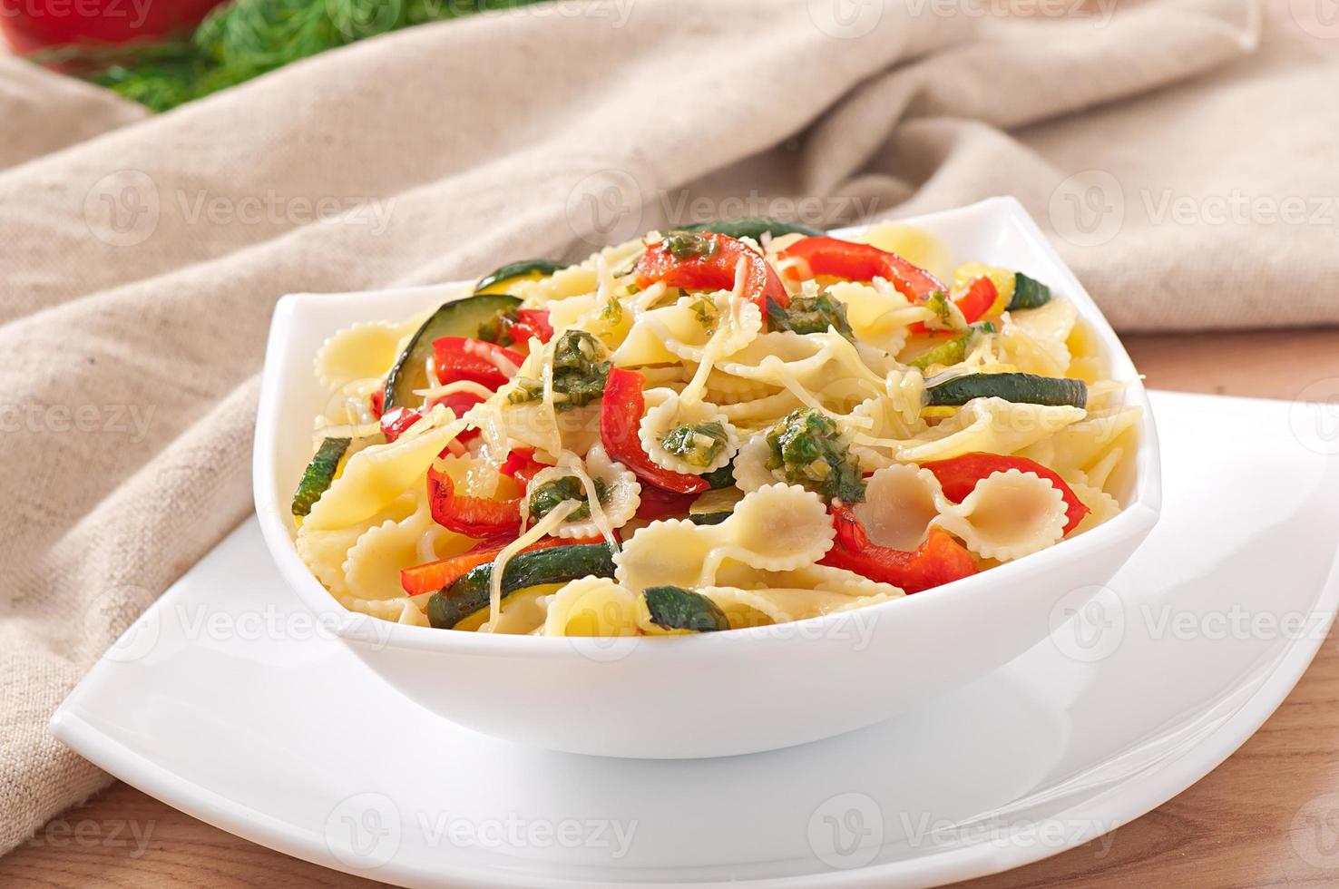 pasta with zucchini and sweet peppers with basil-garlic dressing photo