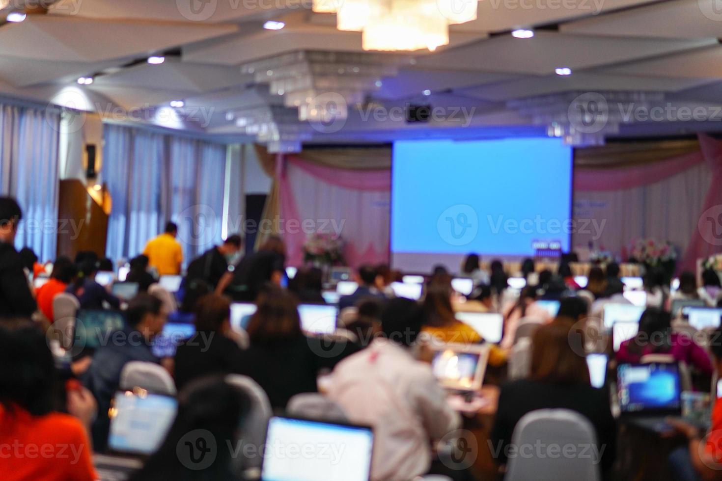 Blurry image in conference room. Abstract blurred people lecture and discussion in seminar room or conference room. photo