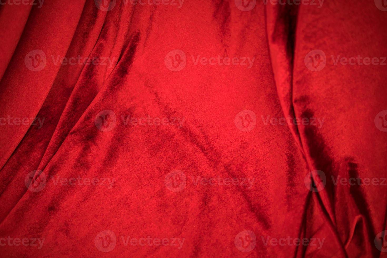 Fold soft waved red velour fabric textured background. photo