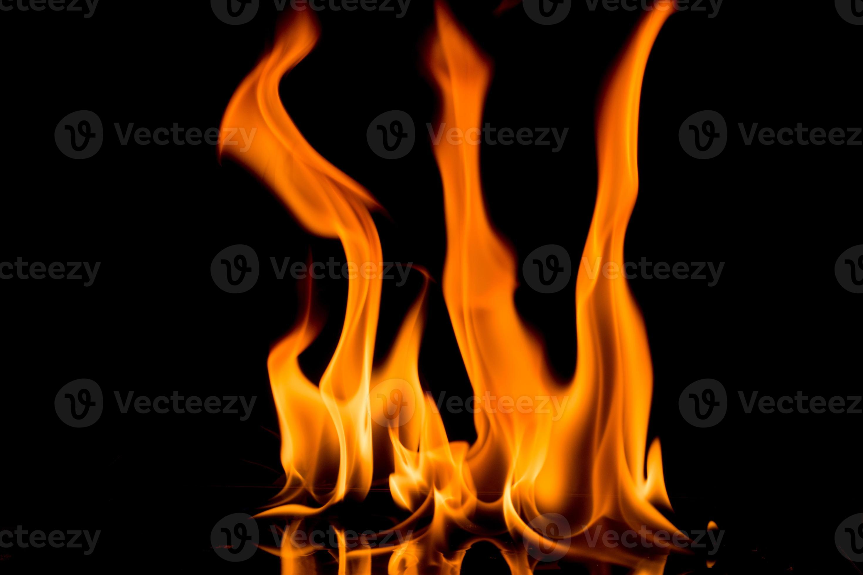 Nature Fire flames on black background. Freeze motion of Red-Yellow fire  flames burning at dark night. 7132851 Stock Photo at Vecteezy