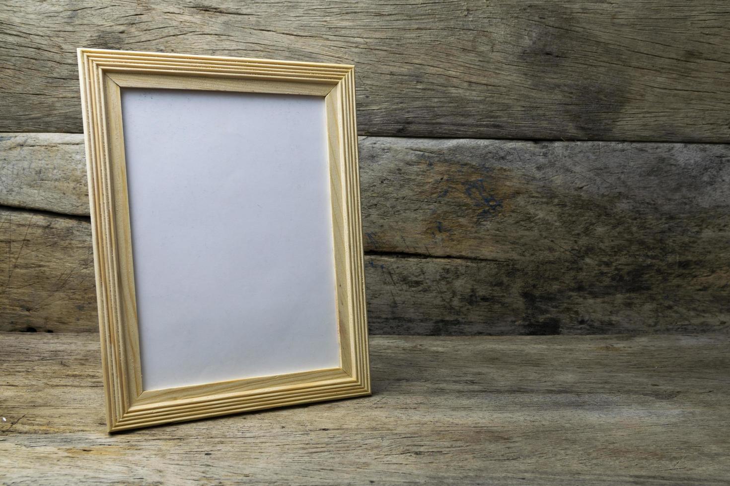 Wood photo frame on wooden table